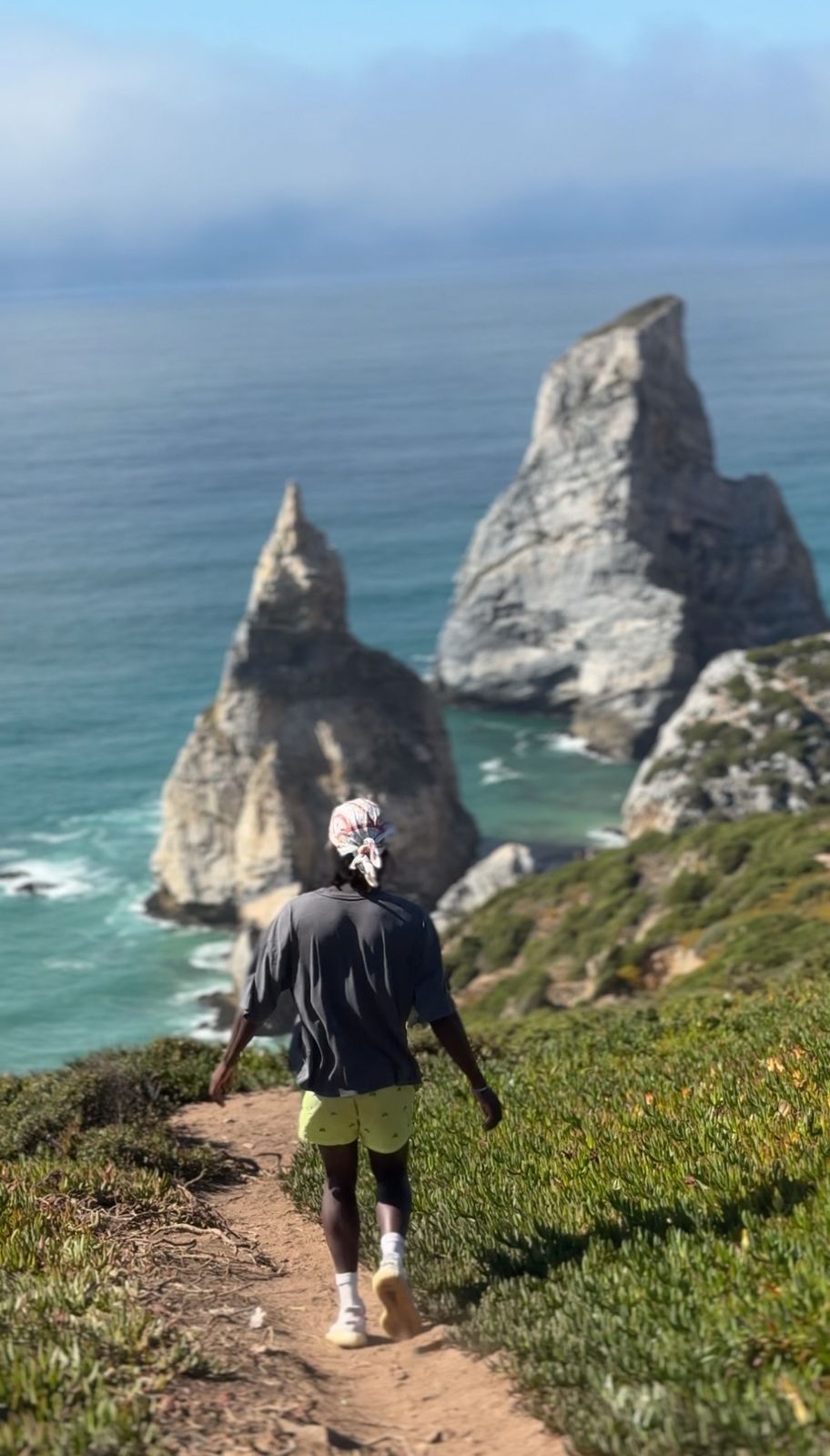 Zach traveling along a dramatic coastline